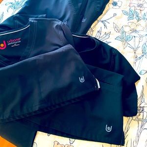 Two sets of black urbane scrubs